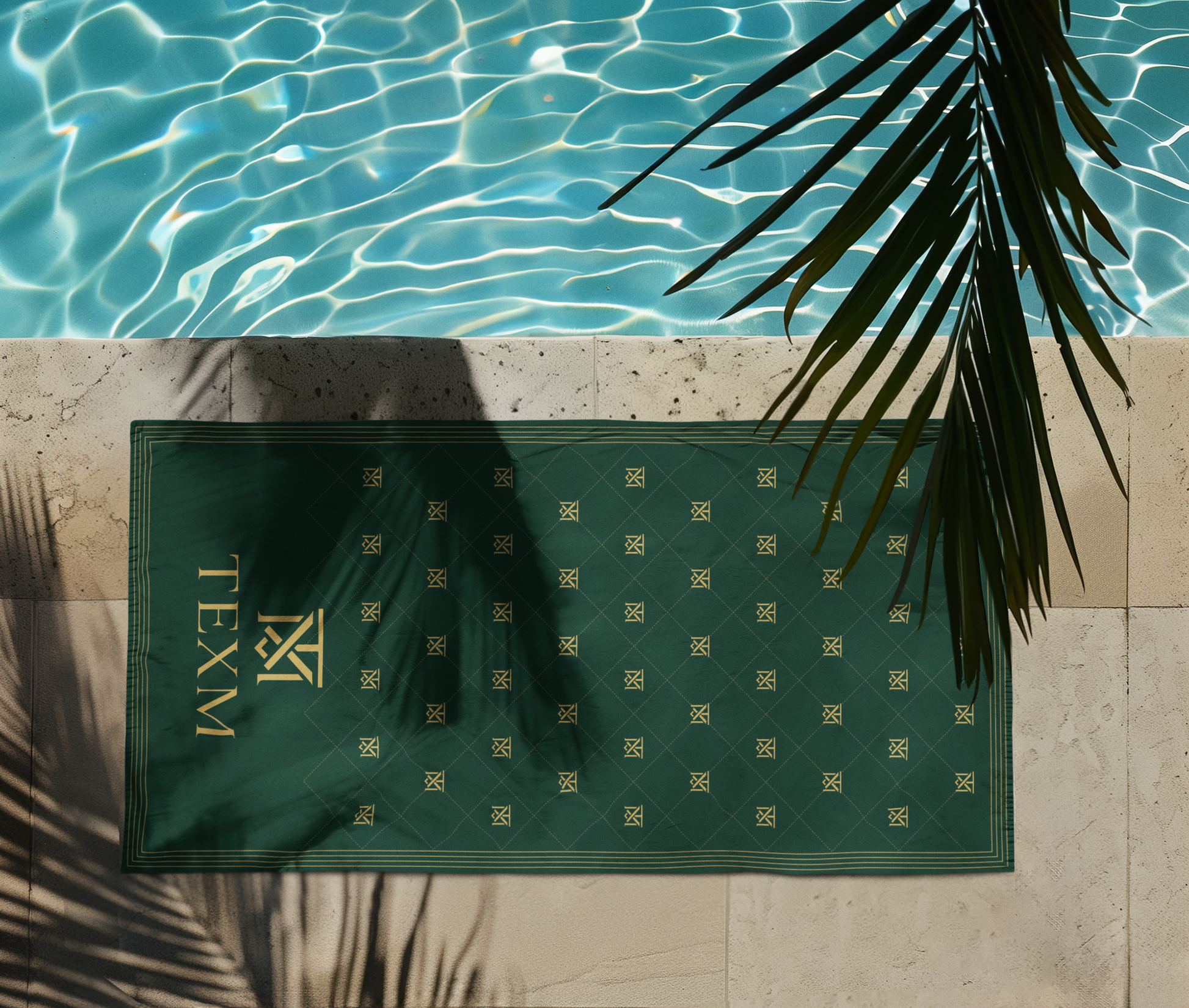 TEXM Heritage Forest Green & Gold beach towel laid on warm sand by the shore