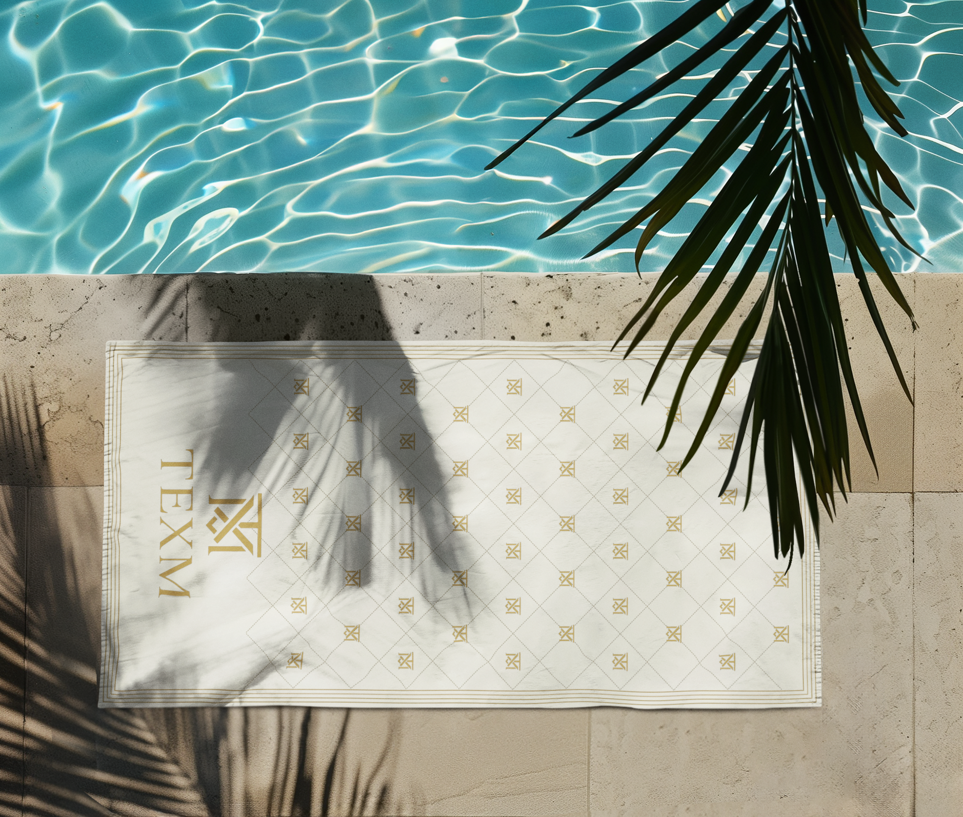 TEXM Heritage Cream & Gold beach towel laid on warm sand by the shore